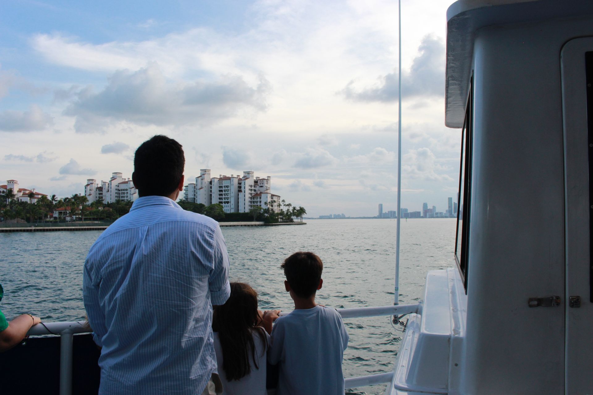 Family enjoying views of the Skyline of Fisher island in Miami