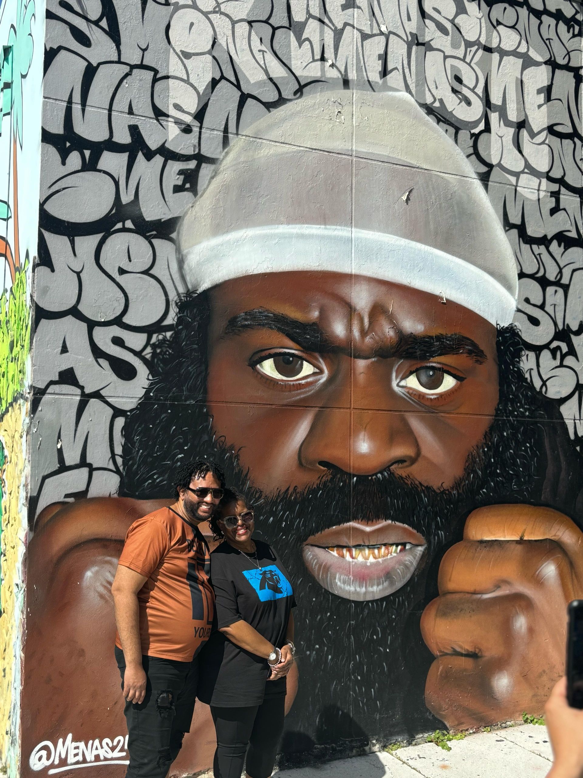 Kimbo Slice mural in Wynwood Miami, showcasing a bold tribute to the legendary fighter surrounded by vibrant street art and graffiti.