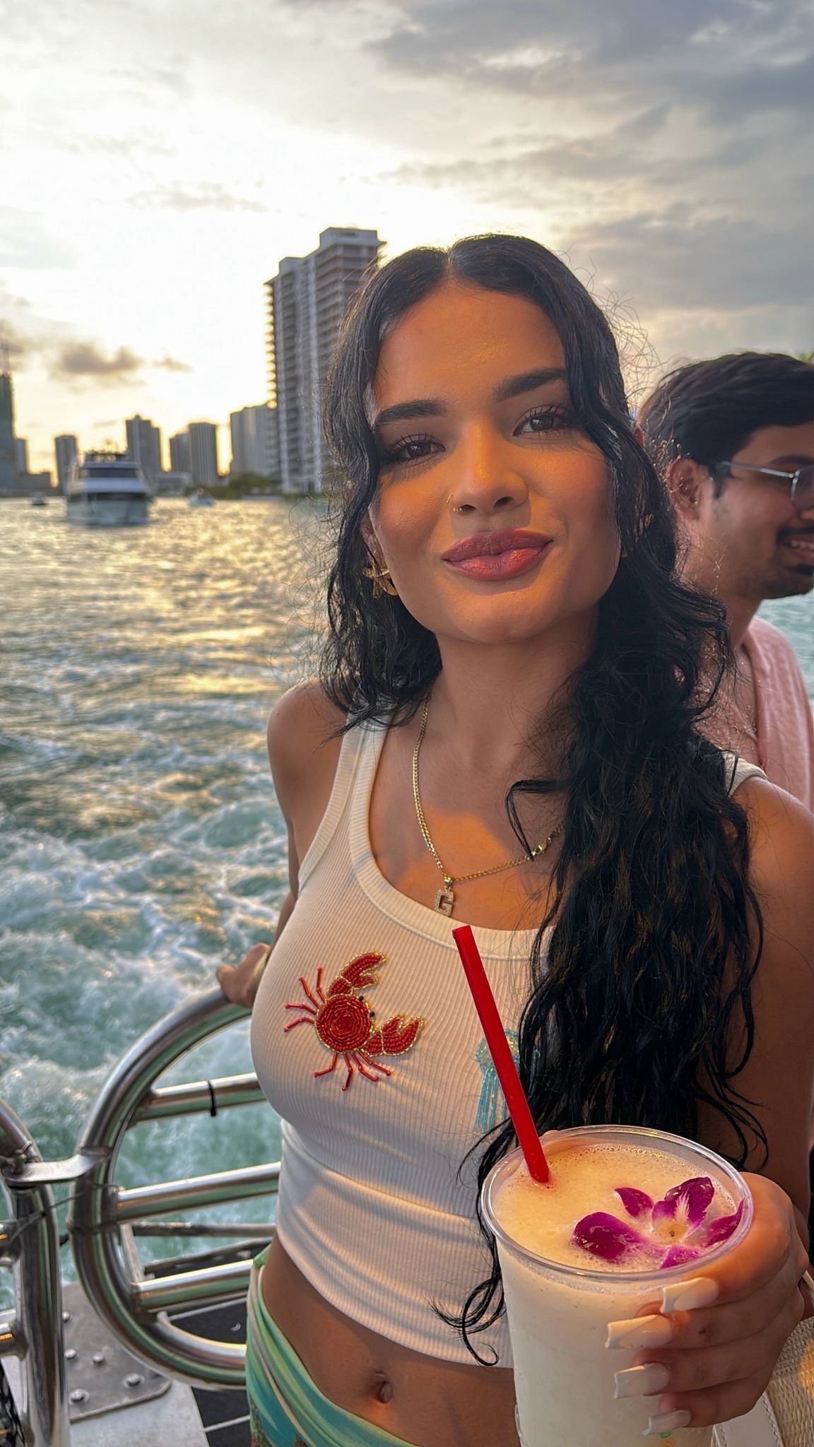 Miami woman enjoying a drink on the Miami boat tour with Florida Resident Discount
