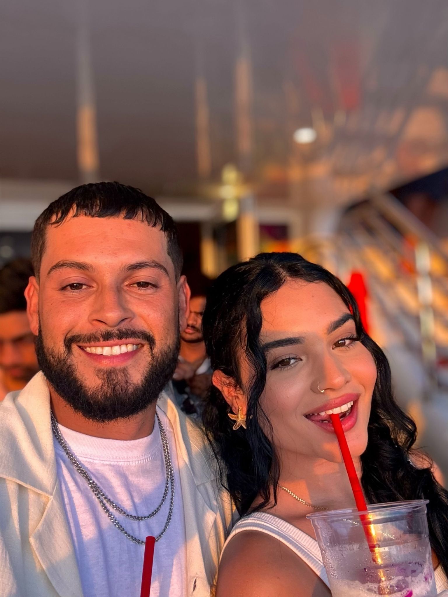 Miami couple enjoying a romantic sunset boat ride on Biscayne Bay using the Miami305 promo code
