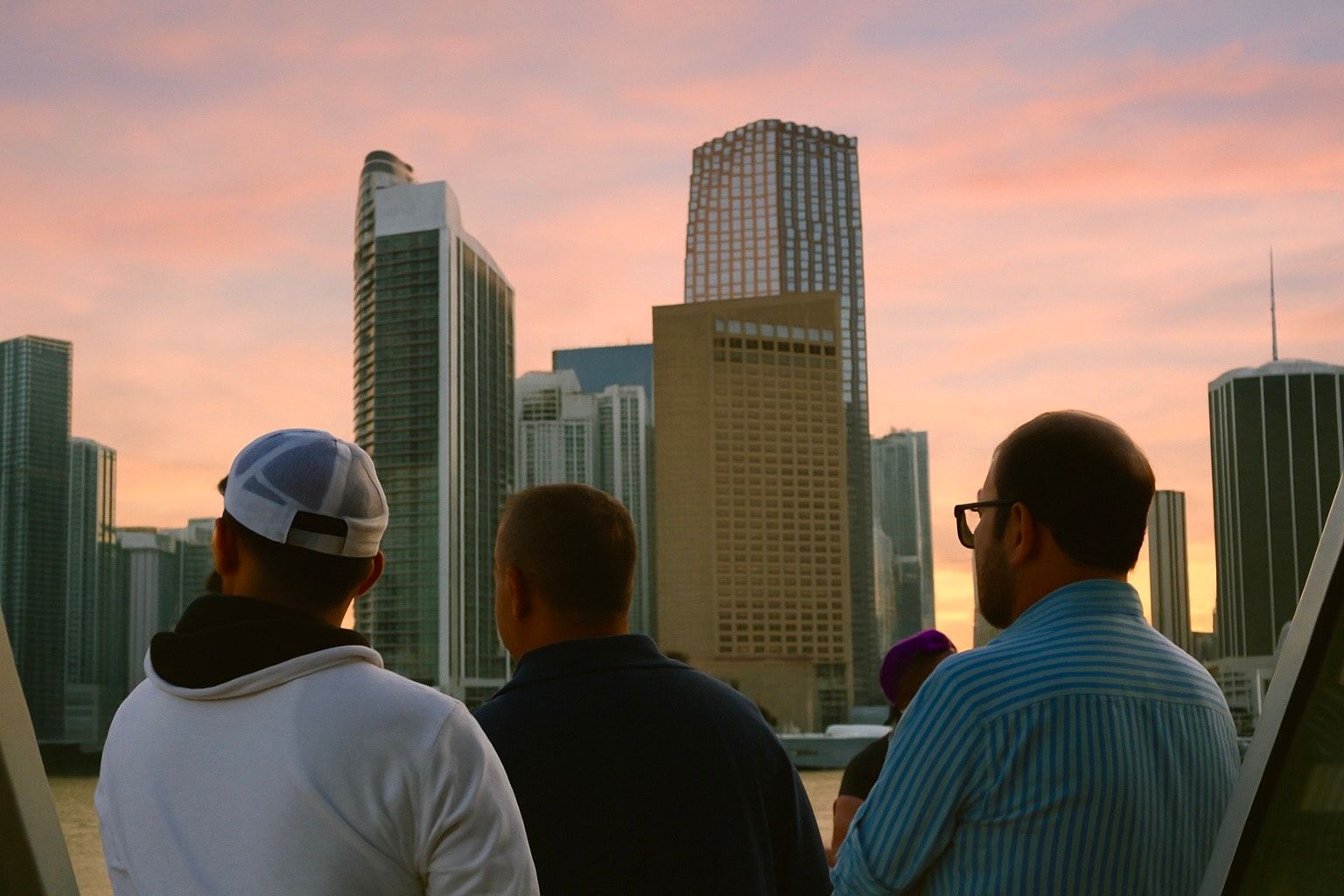 Guest looking at the Miami Skyline from the Miami Boat Tour of celebrity Mansions
