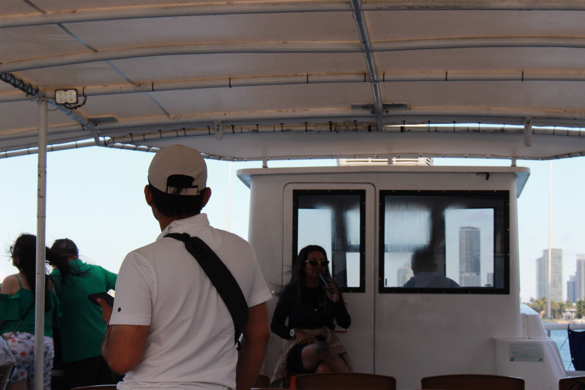 Local tour guide giving a sightseeing boat cruise in Biscayne Bay with skyline views

