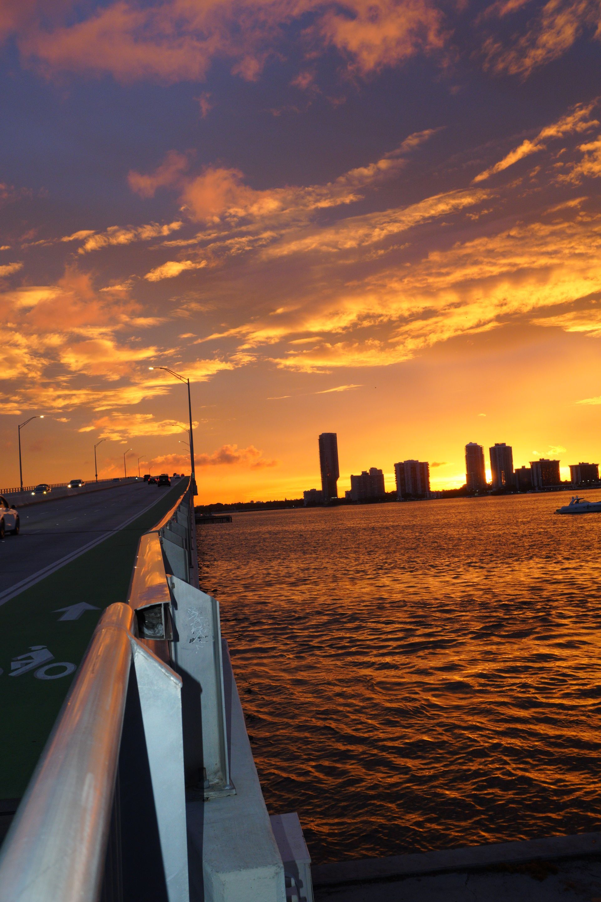 Sunset view of Biscayne Bay and the skyline from a city causeway