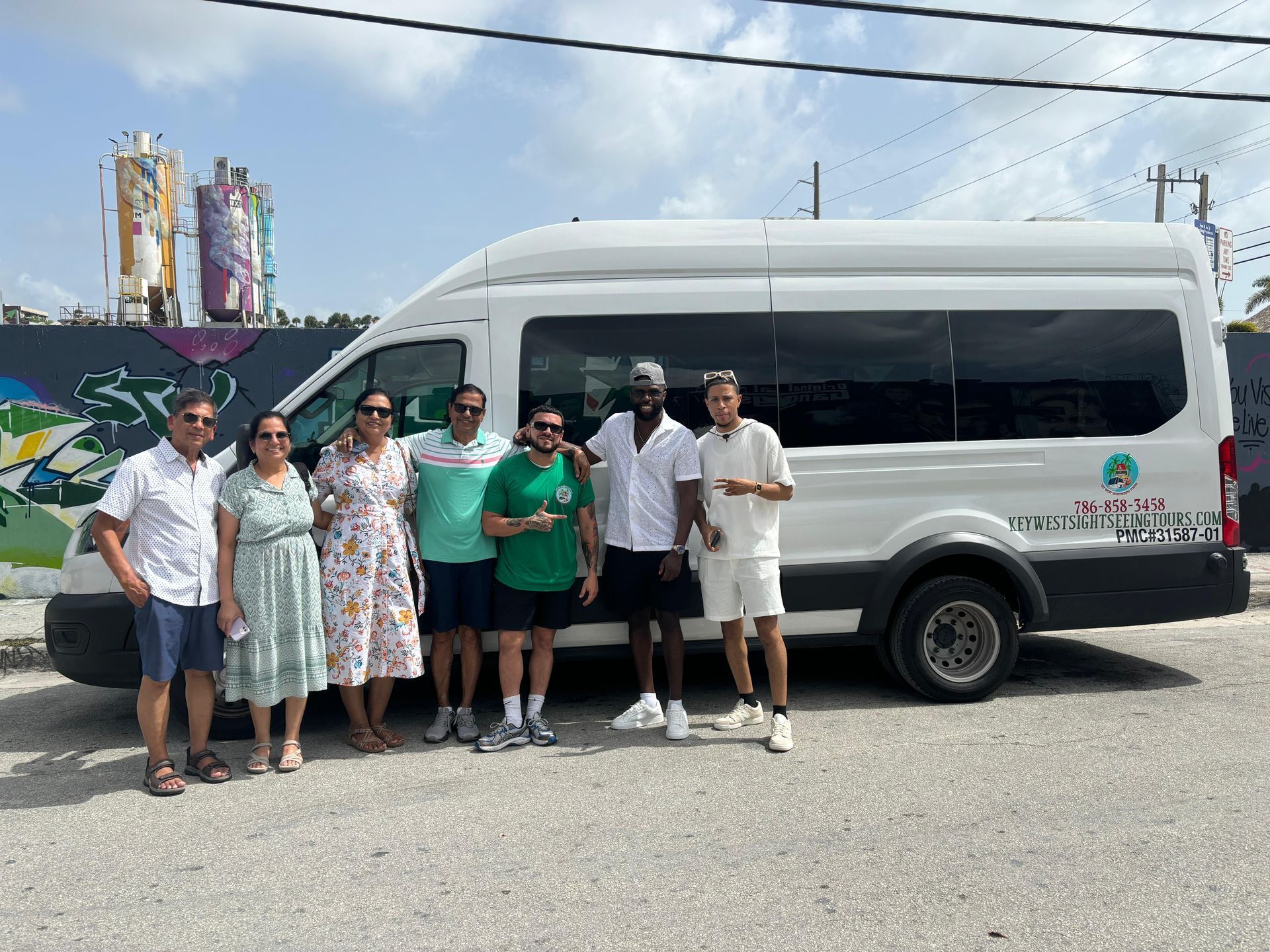 Wynwood Walls group photo during guided Miami city tour with private sightseeing bus