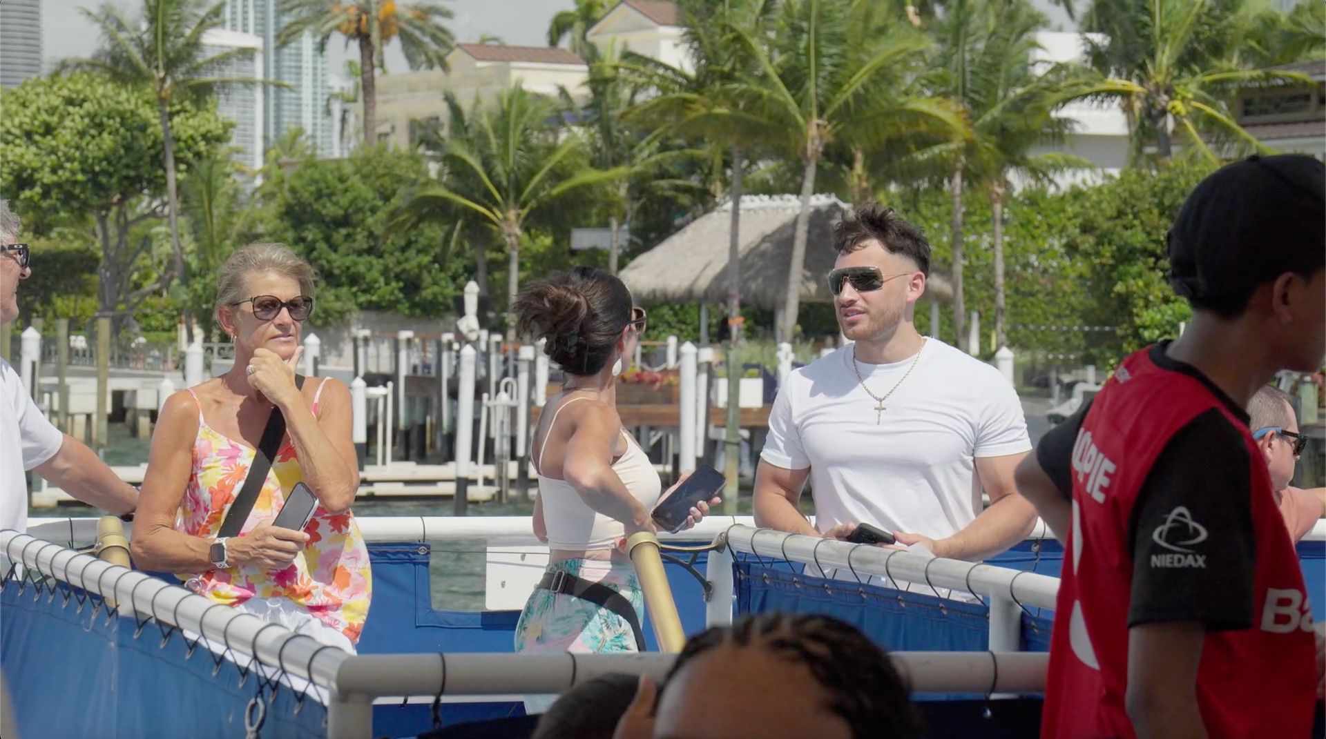 Miami Island Tour Boat passengers looking at Mansions in Star Island