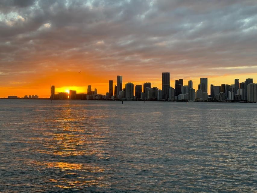 Miami skyline at sunset seen from the water with Downtown Miami and Biscayne Bay.