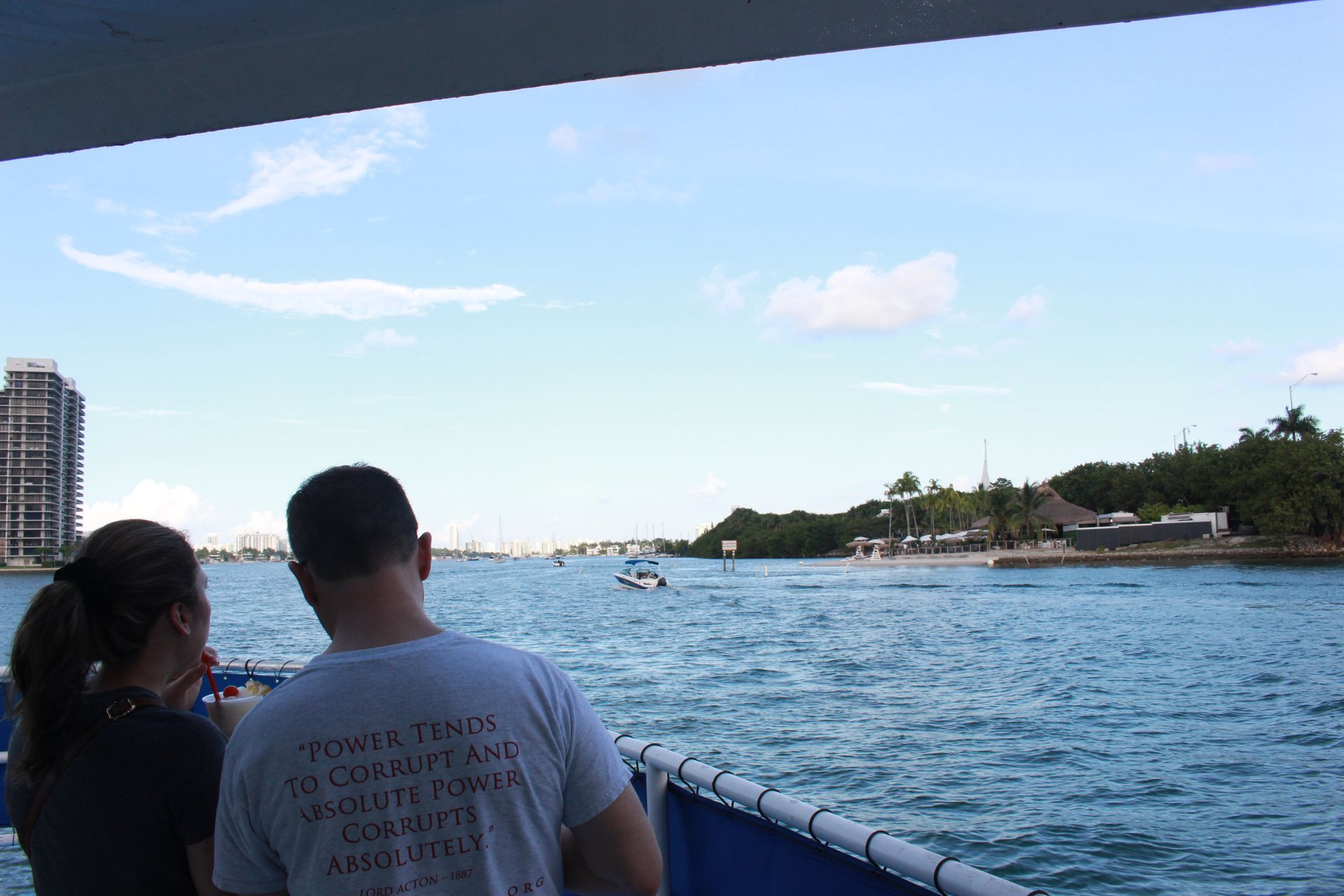 Miami Tour boat couple enjoying views of Jungle Island and Biscayne Bay
