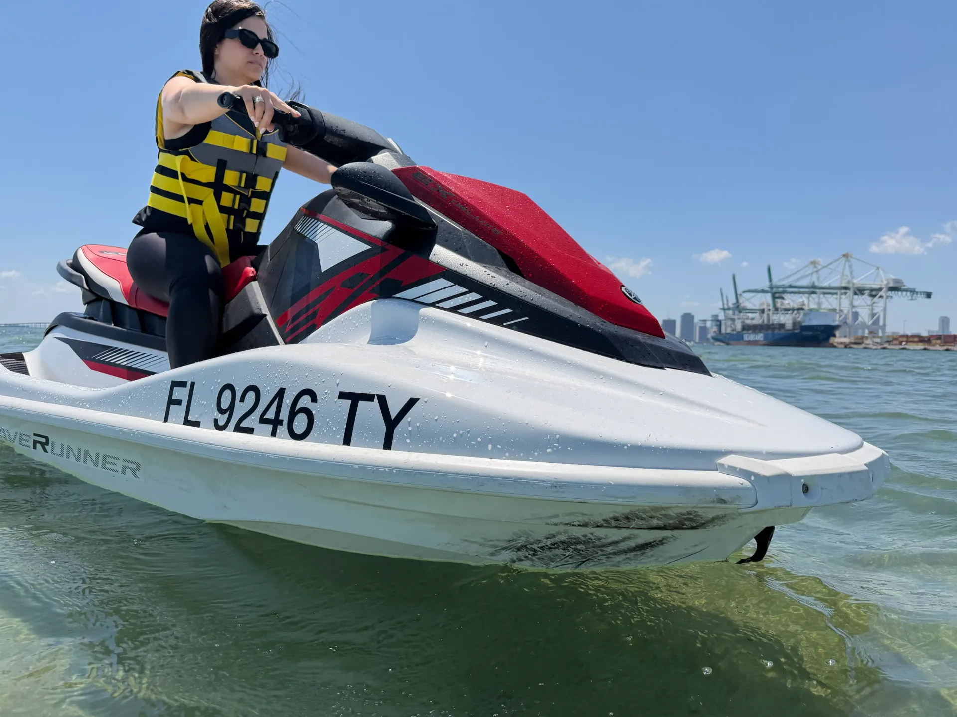 Guest enjoying a Yamaha WaveRunner during a Miami Top Water Tour near the Port of Miami waterfront