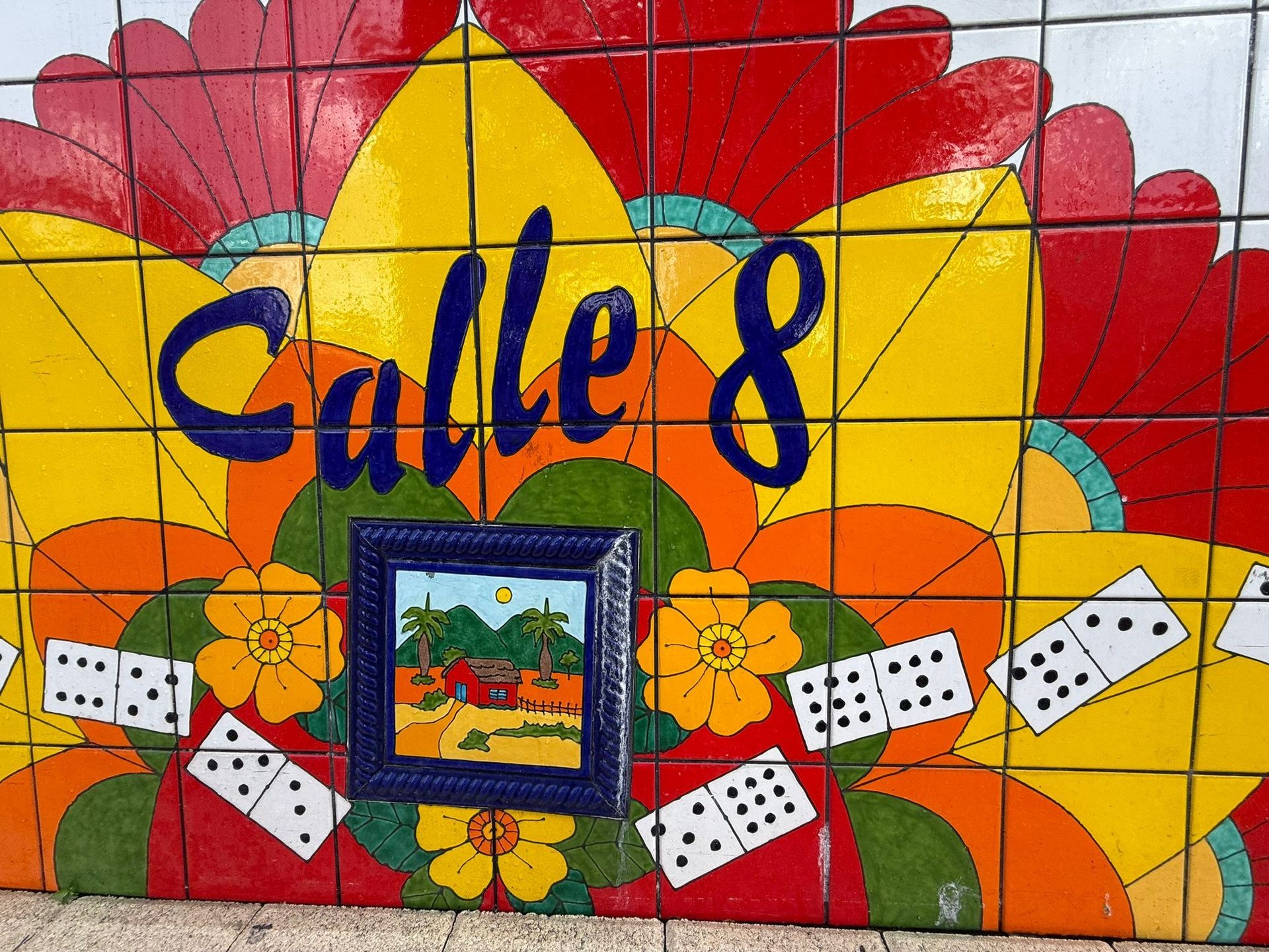 Vibrant tile mural of Calle Ocho with dominoes in Little Havana, showcasing Cuban heritage during a cultural sightseeing experience in Miami