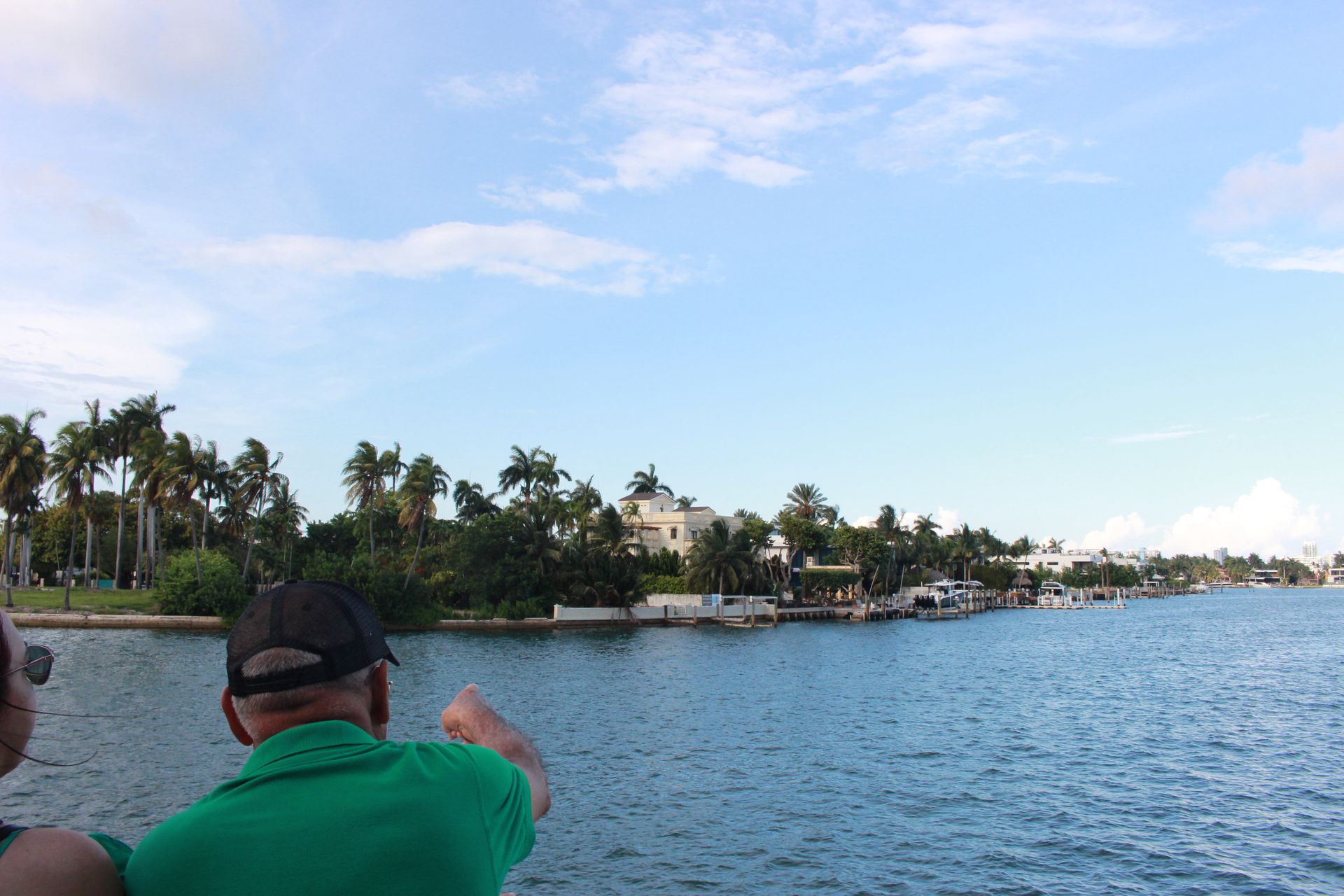 Boat tour Miami with passengers admiring Star Island celebrity homes
