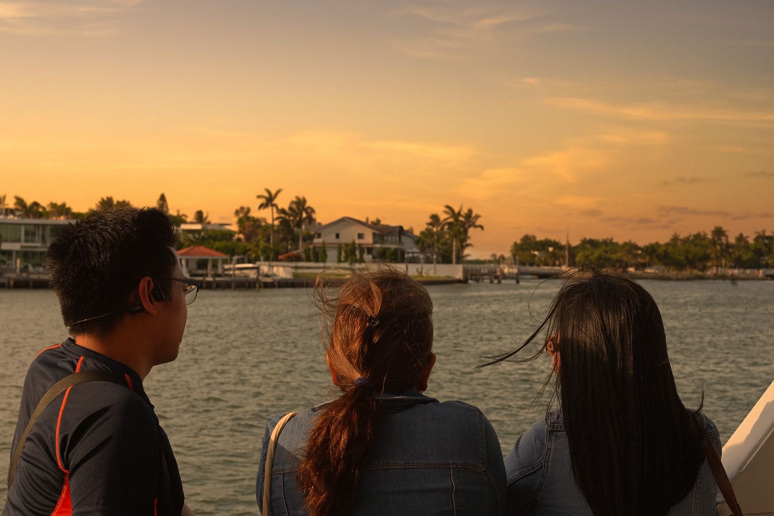 Guest in a Miami Sunset Cruise looking at the Celebrity Mansions in Star Island