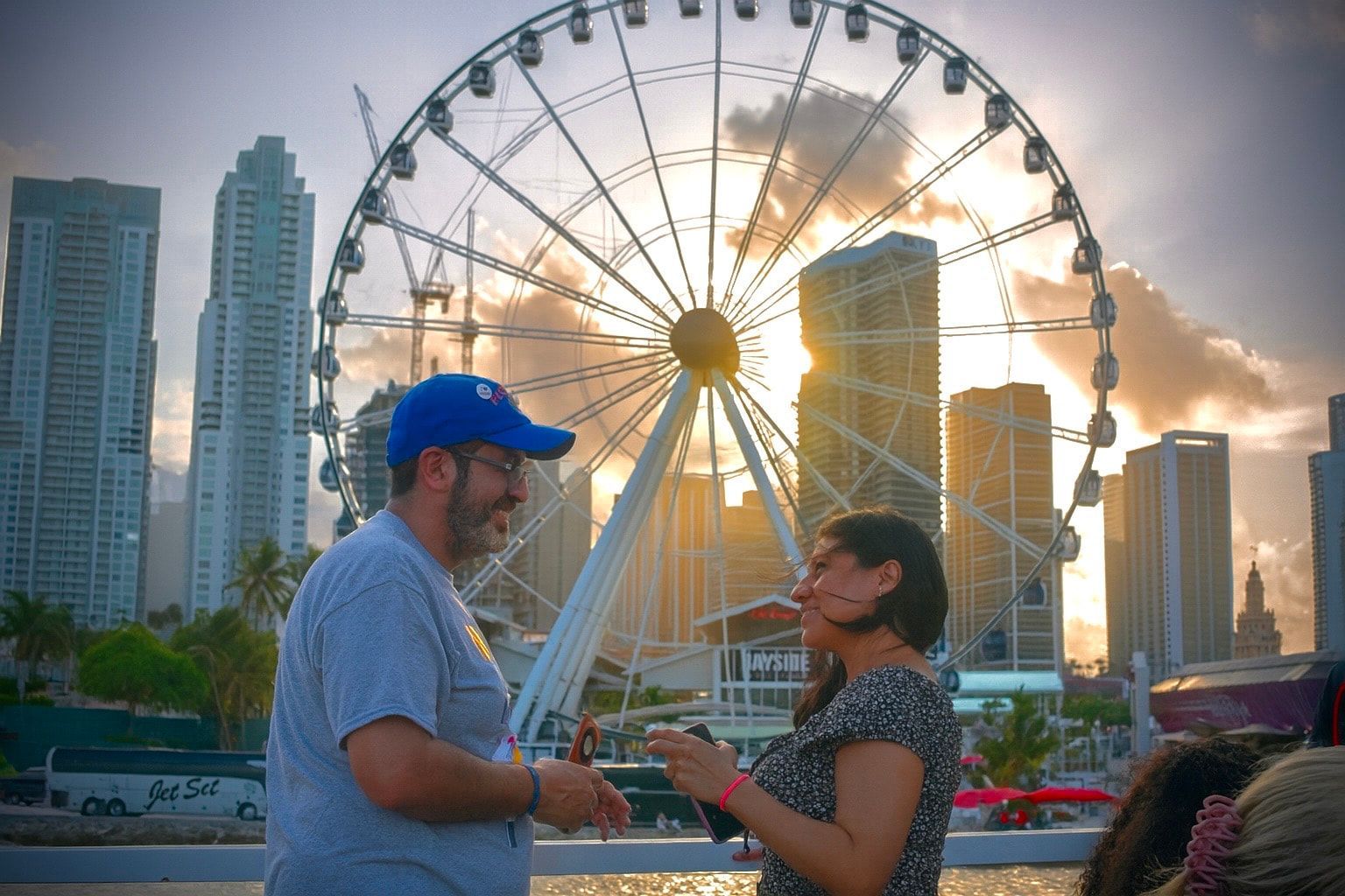 Guests enjoying Miami Tours while cruising past the Bayside Ferris wheel and the iconic Miami skyline