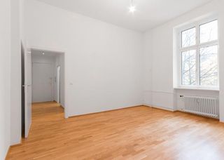 apartment with white walls and wooden floor
