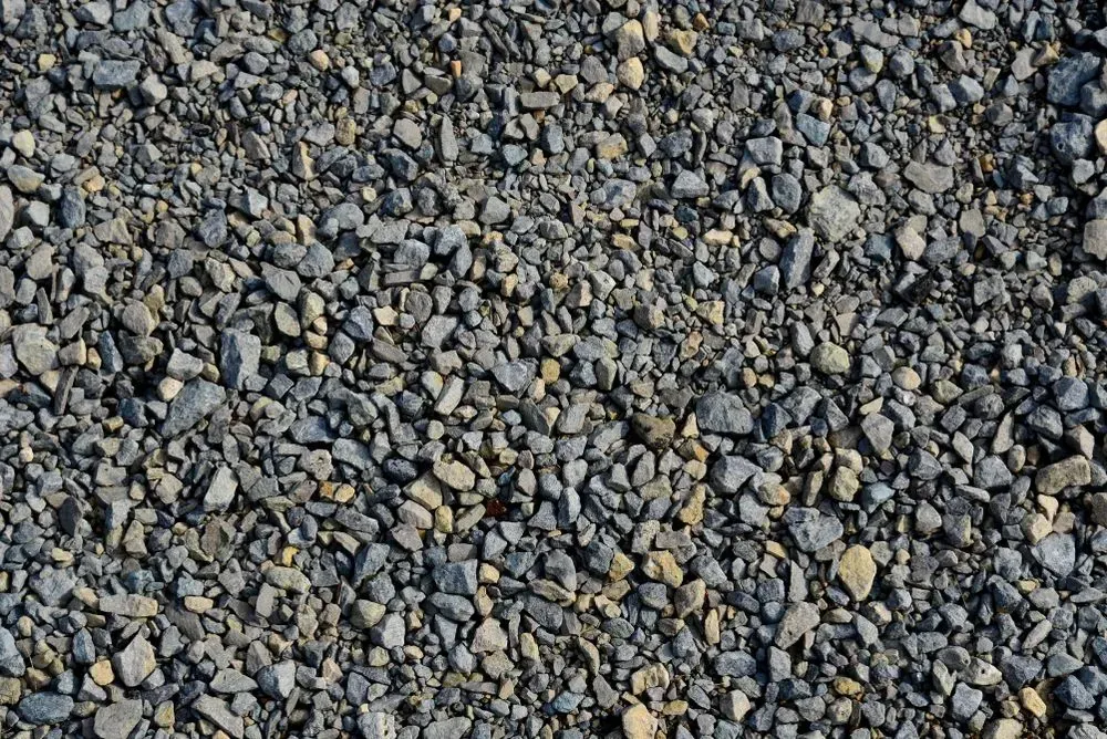 Gravel Stones, Gray and Tan, Covering a Surface — Gladstone Garden & Landscaping Supplies In Burua, QLD