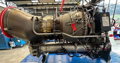 Safran Arriel helicopter engine module displayed in a maintenance facility, showing turbine componen