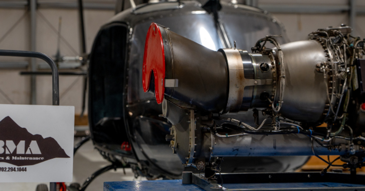 FAA-certified technician inspecting Safran Arriel engine module on Airbus H125 helicopter at Boulder City facility FAA-certified technician inspecting Safran Arriel engine module on Airbus H125 helicopter at Boulder City facility
