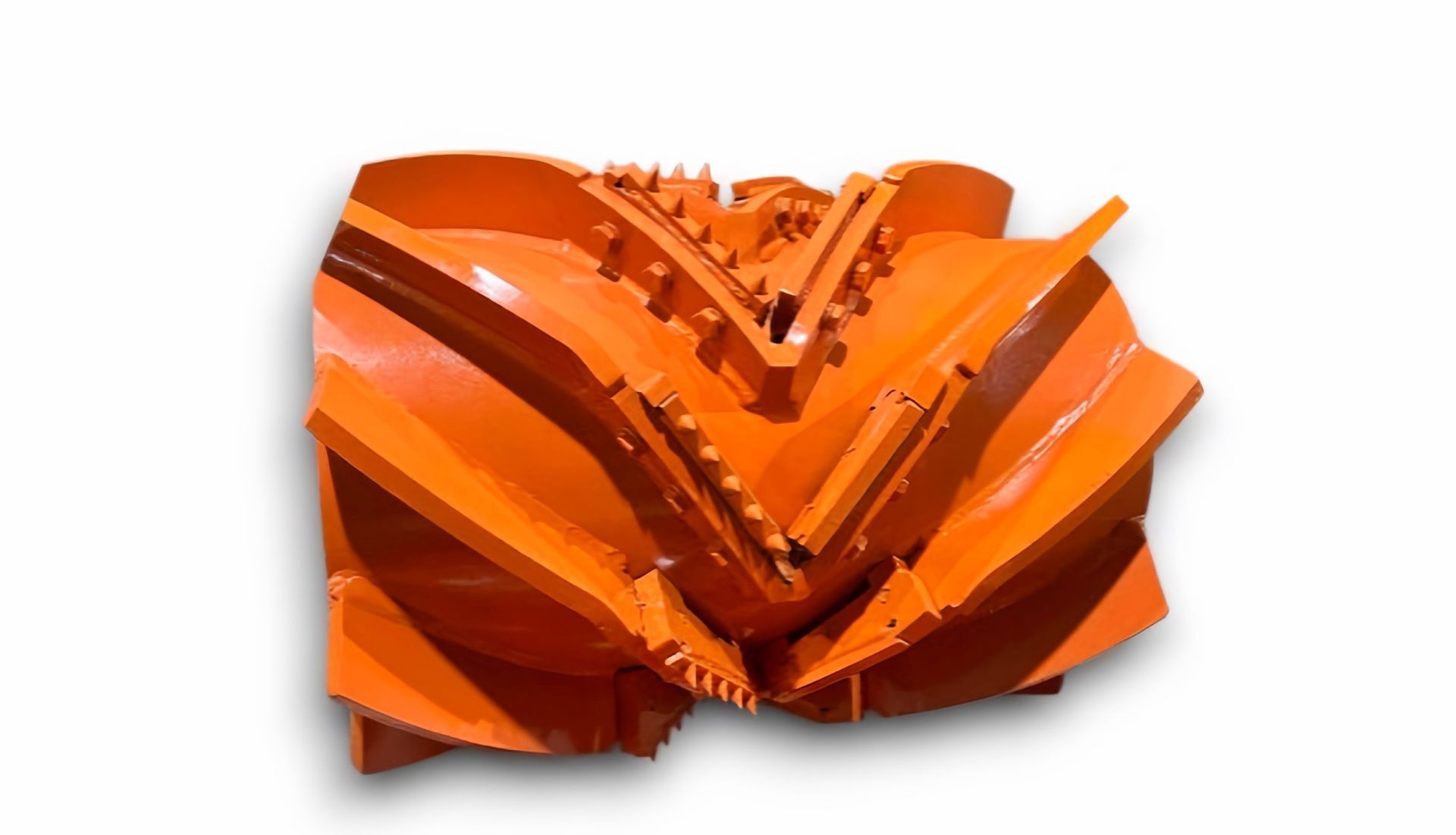 Orange spiked roller, possibly for soil compaction or breaking up material.