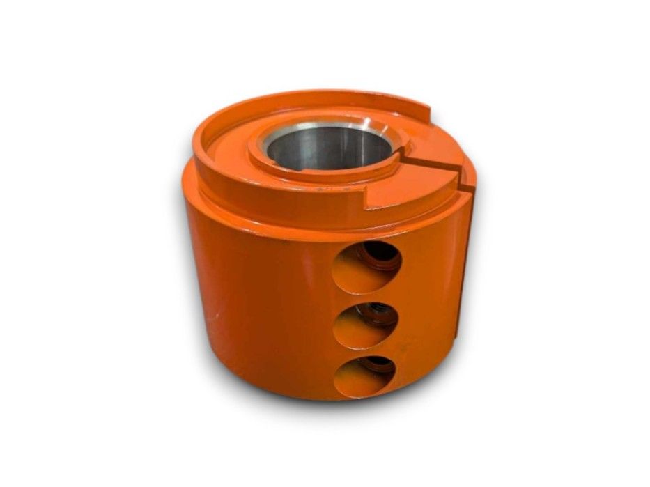 Orange, large, toothed auger used in agricultural machinery.