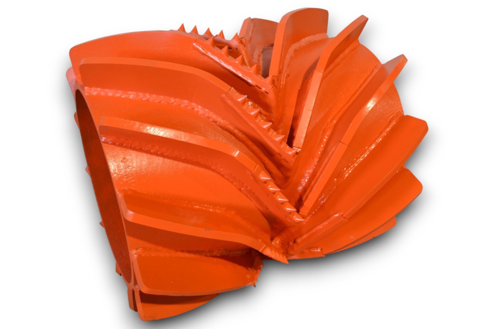 Orange spiked roller, possibly for soil compaction or breaking up material.