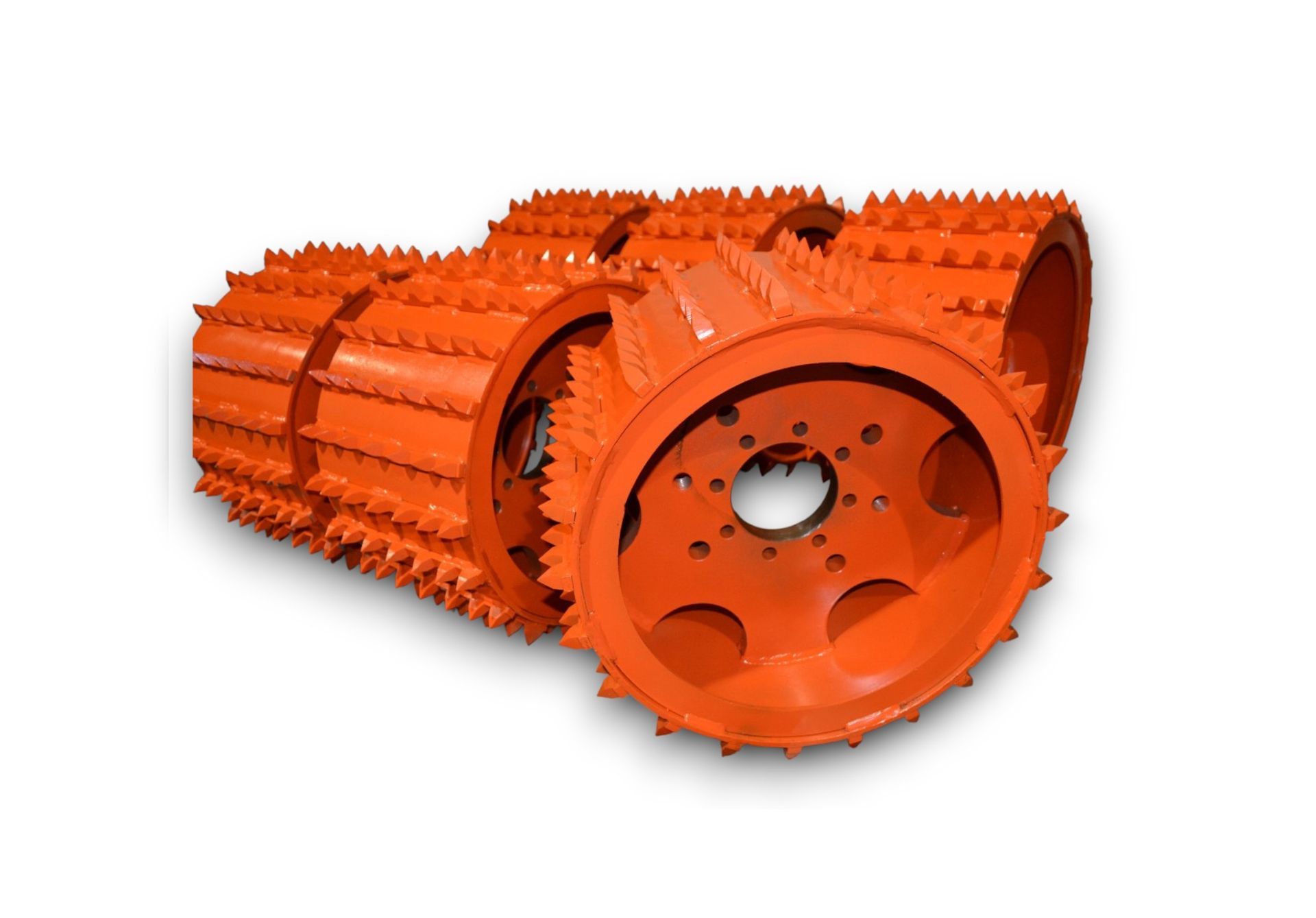 Orange spiked roller, possibly for soil compaction or breaking up material.