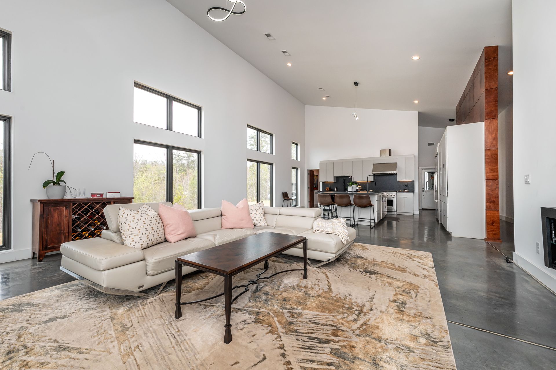 A living room with a couch , coffee table , and rug.