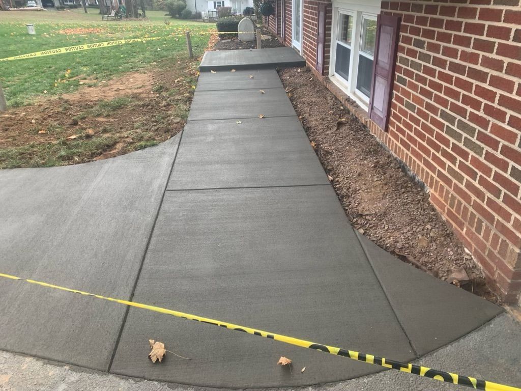 Concrete Sidewalk and stoop with a broom finish installed in Fallston, MD