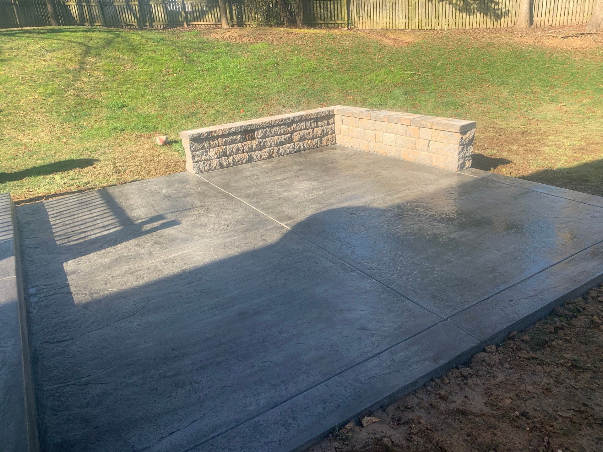 Decorative Stamped concrete patio and sitting wall installed in Havre de Grace, Md
