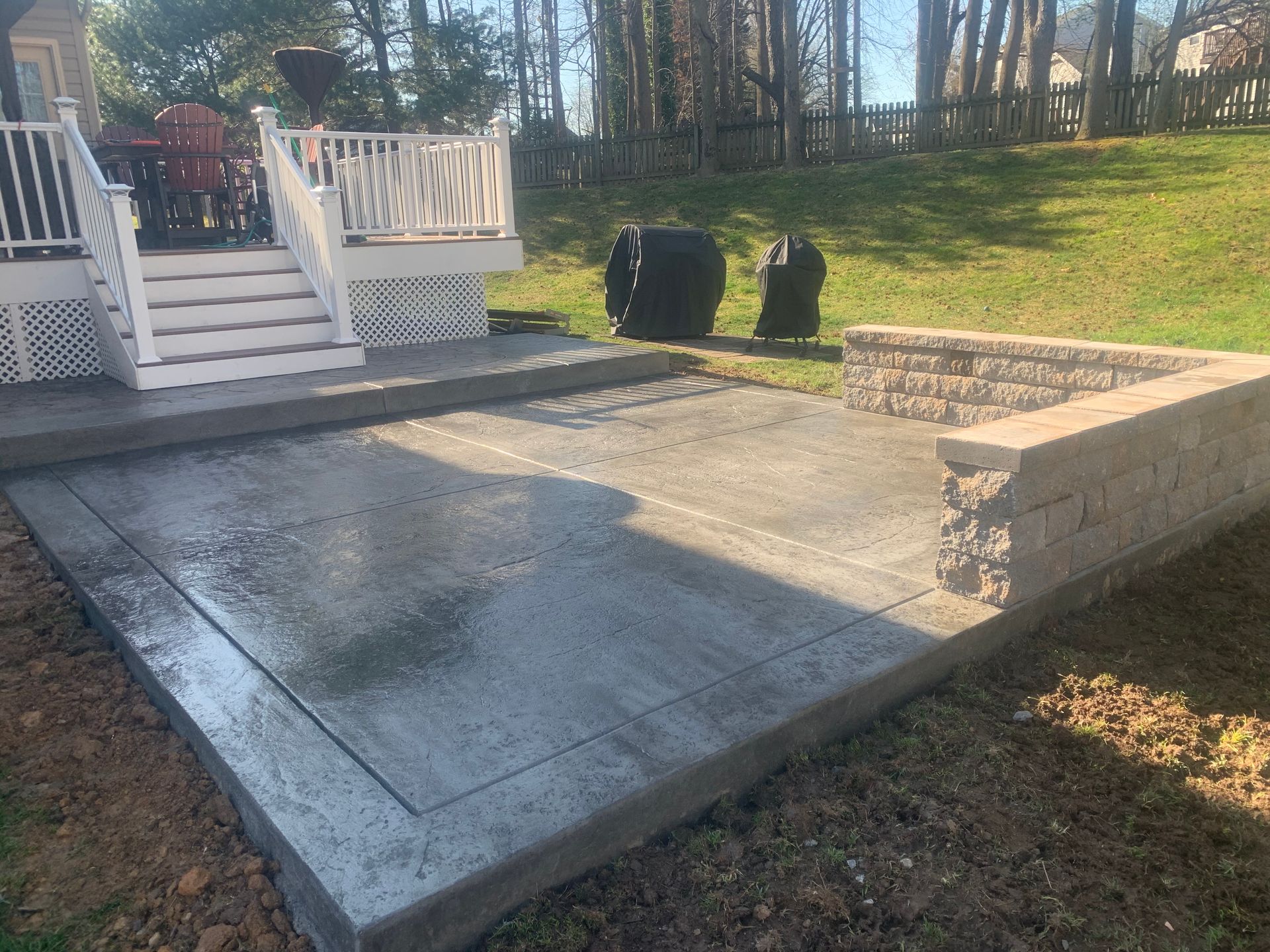Decorative Stamped concrete patio and sitting wall installed in Havre de Grace, Md