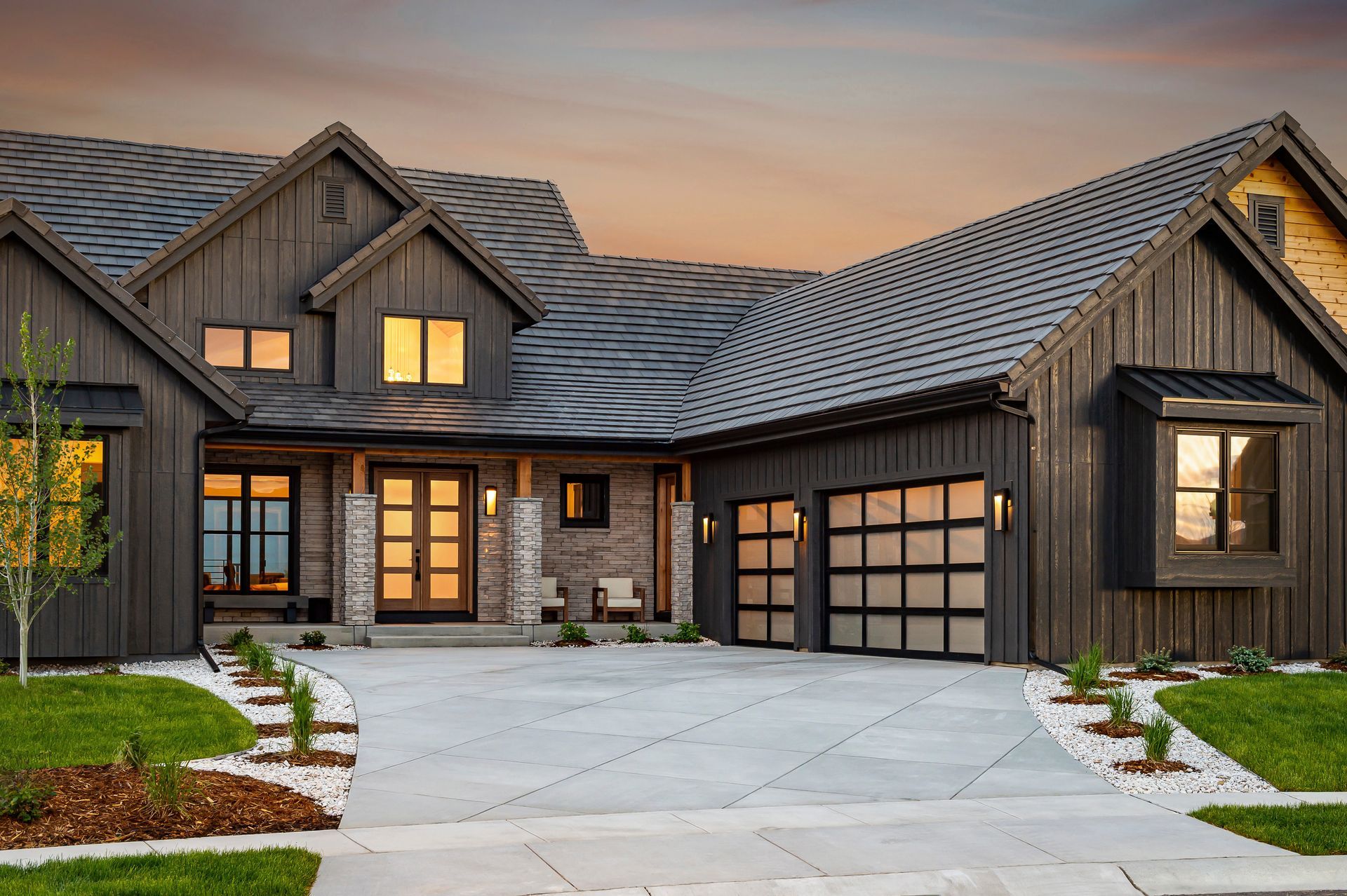 Yellow garage door with a textured surface and windows at the middle.