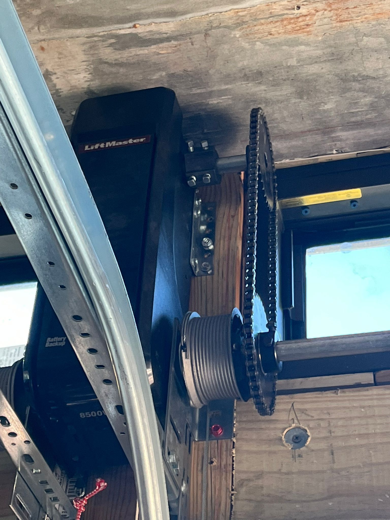 Car parked in front of an automatic garage door.