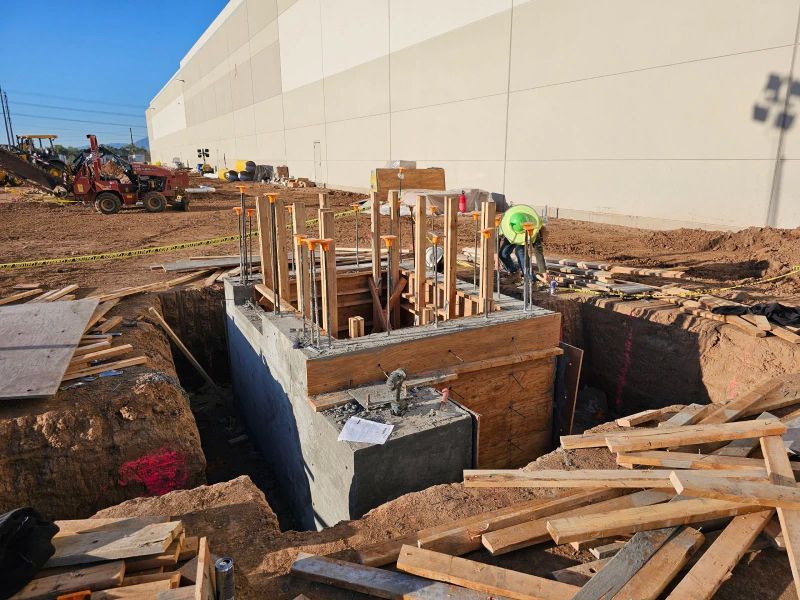 A Group Of Construction Workers Are Working On A Building Under Construction