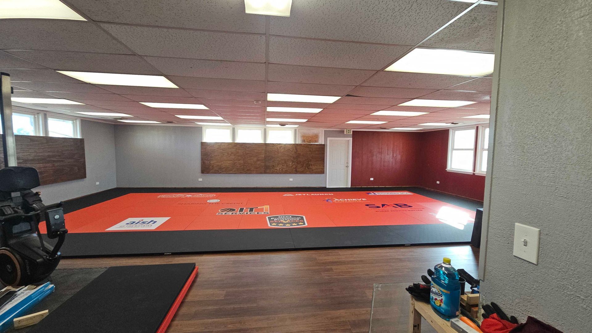 A group of men in suits and ties are standing in front of a car.