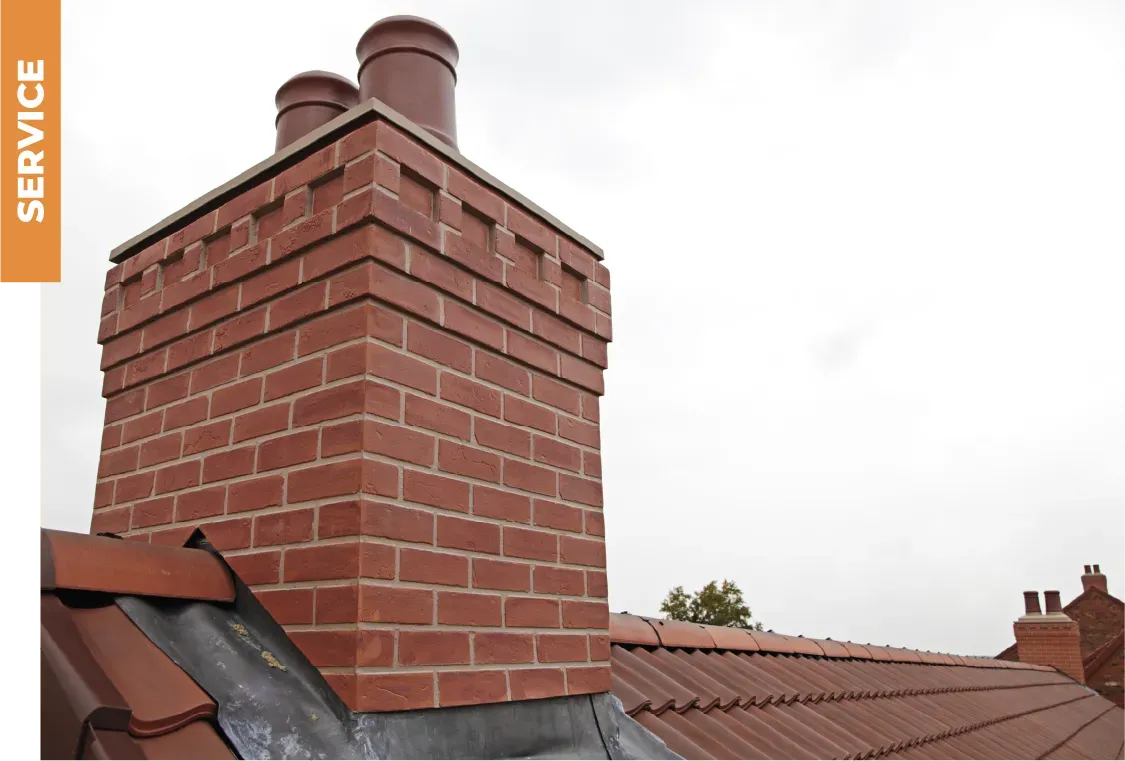 A brick chimney on top of a roof with the word service below it