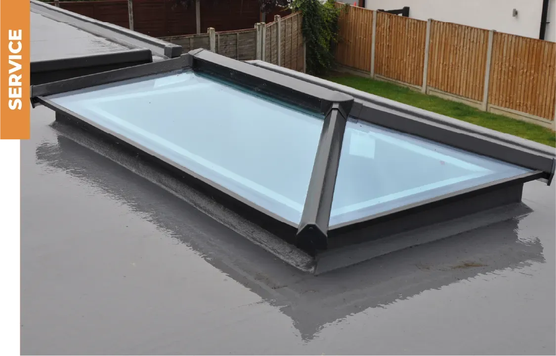 A picture of a skylight on the roof of a house.