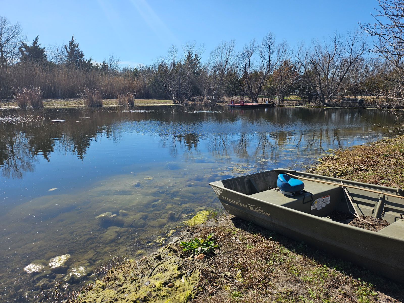 Boat is sitting on the Shore of a Lake - Rockwall, TX - G & G Construction Co.