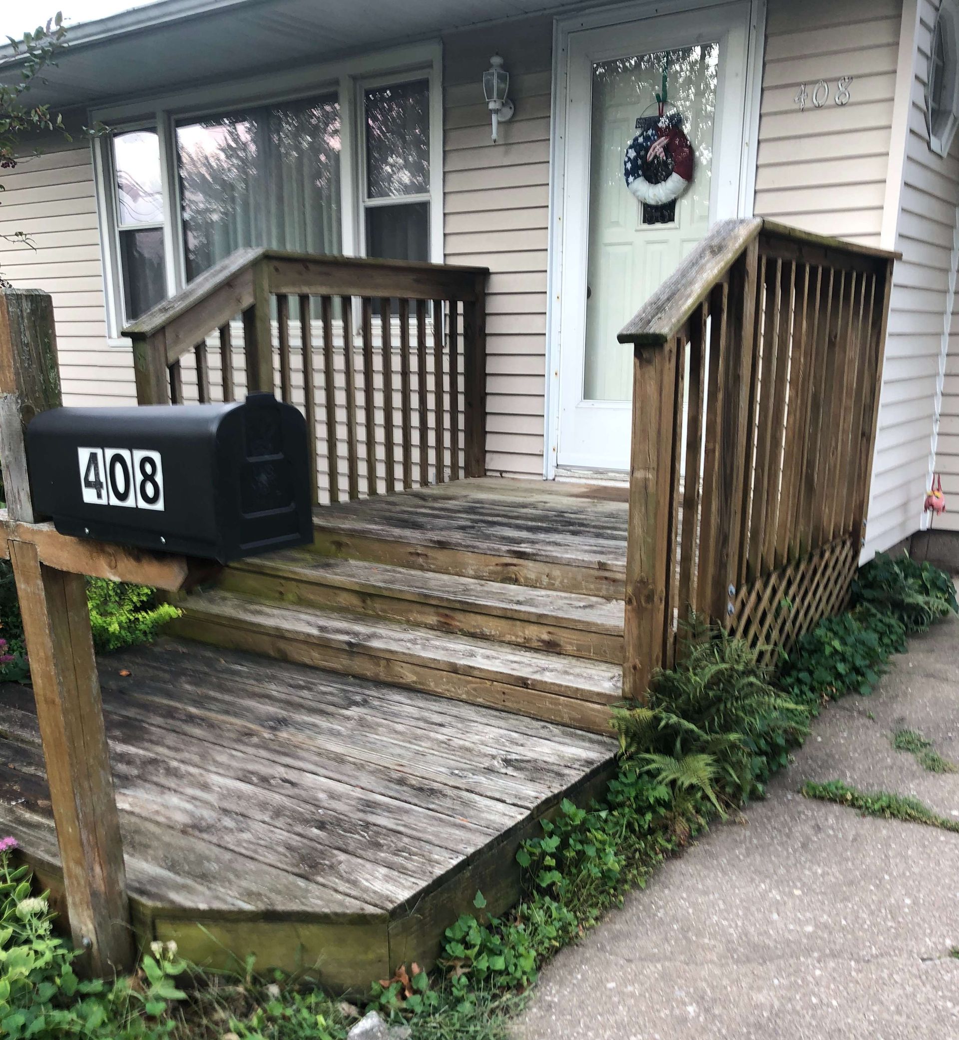 A house with a mailbox that says 408 on it