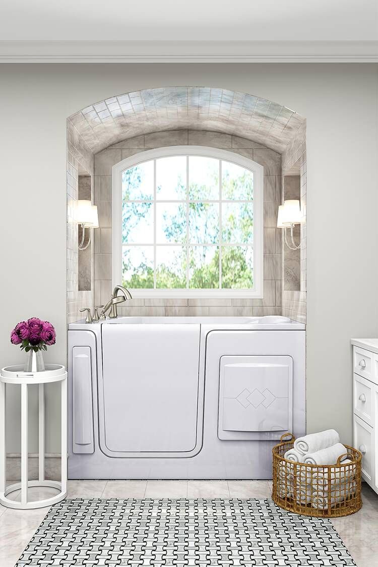 A bathroom with a walk in tub and a window.