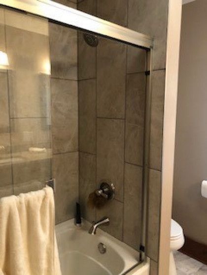 A bathroom with a bathtub and a toilet