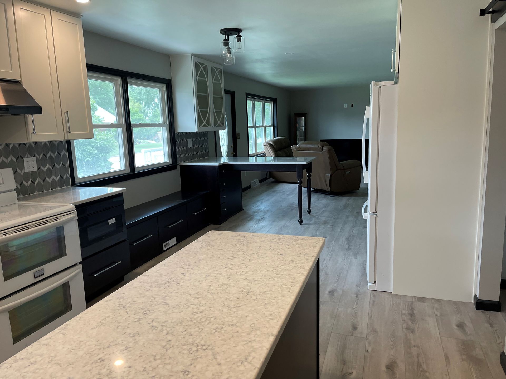 A kitchen with a large island in the middle of the room.