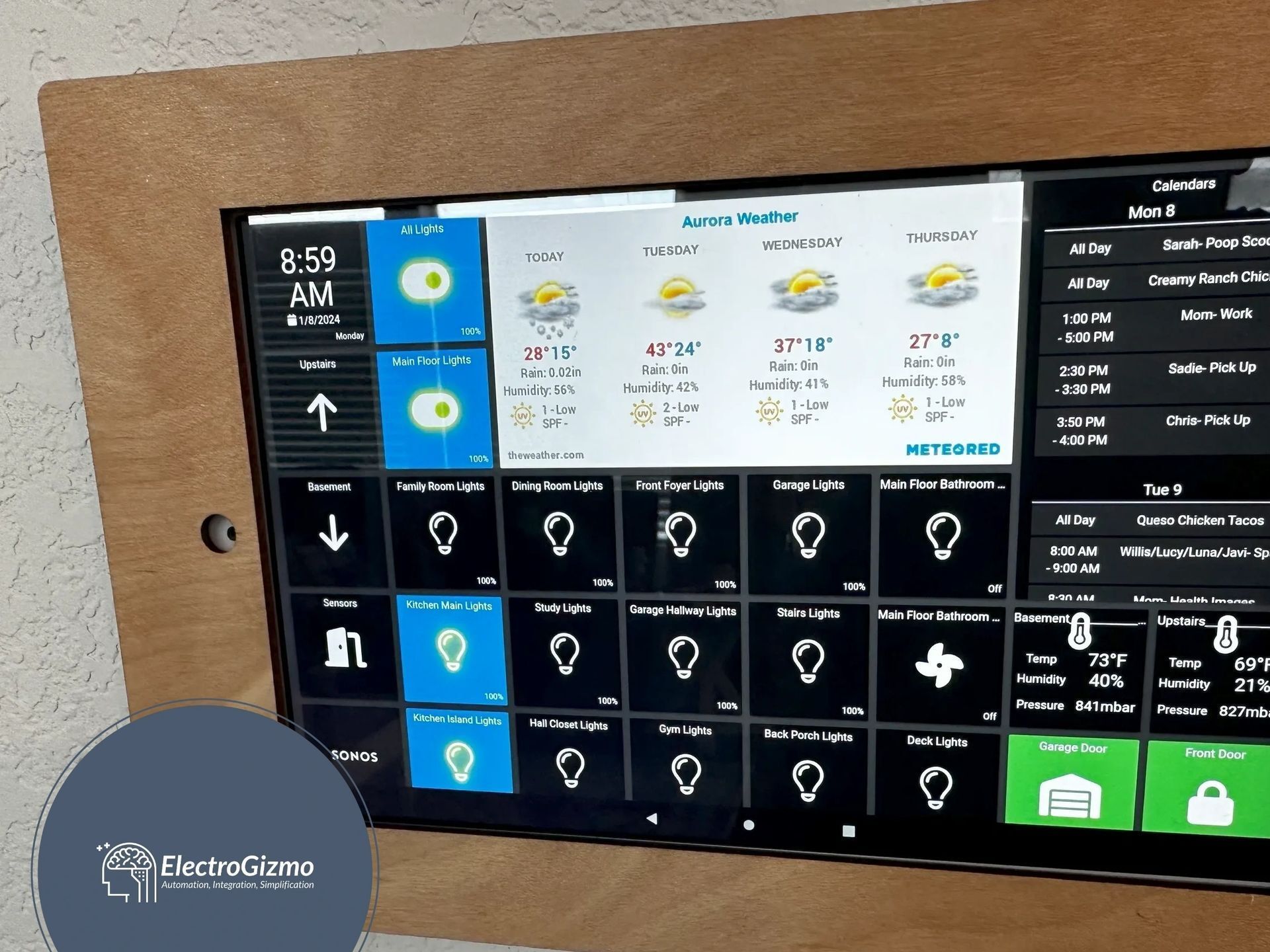 A computer monitor displays the time as 8:59 am