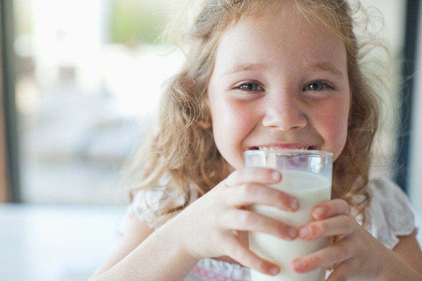 Child with a glass of milk