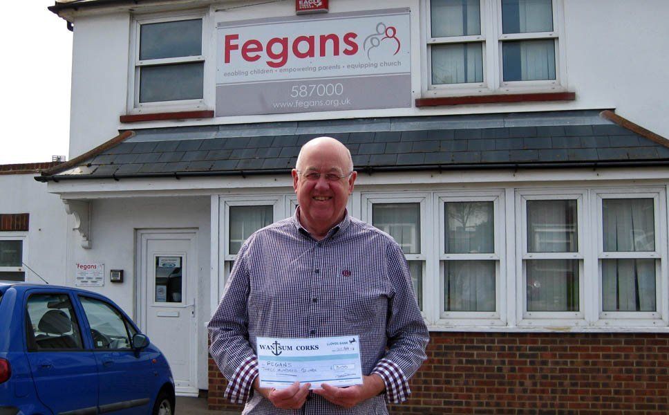 Jim delivers a £300 cheque to Fegans