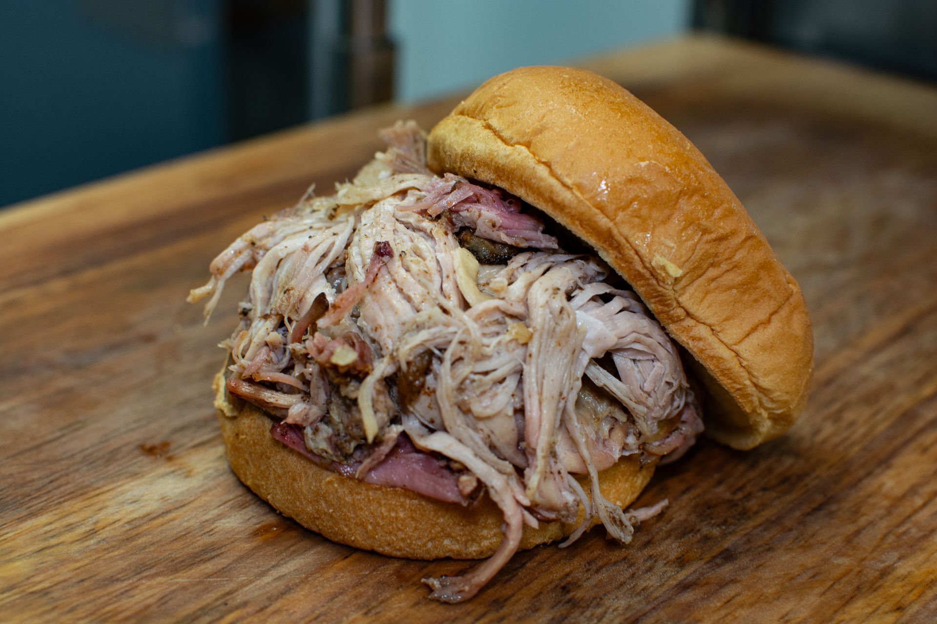 A jar of smokey q sits on a refrigerator shelf