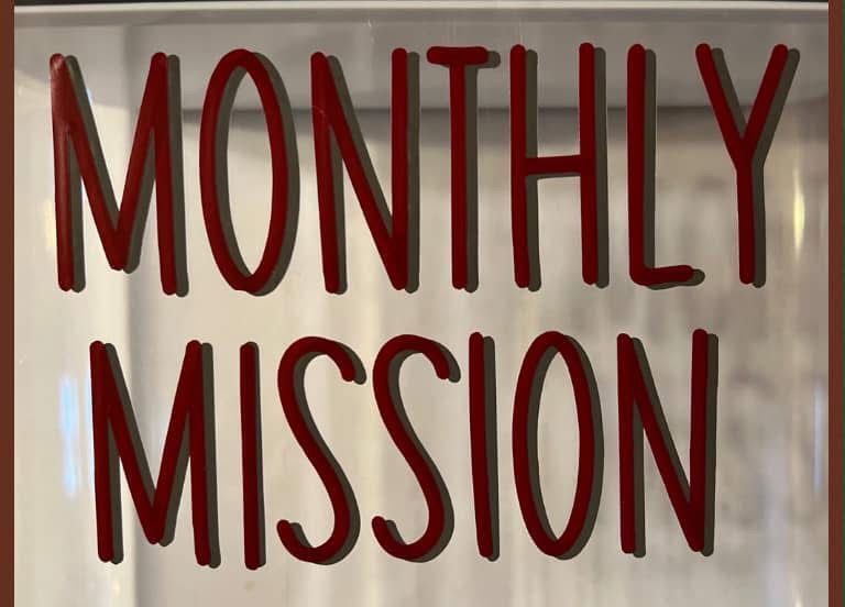 Chicken wings are being cooked in a smokehouse.