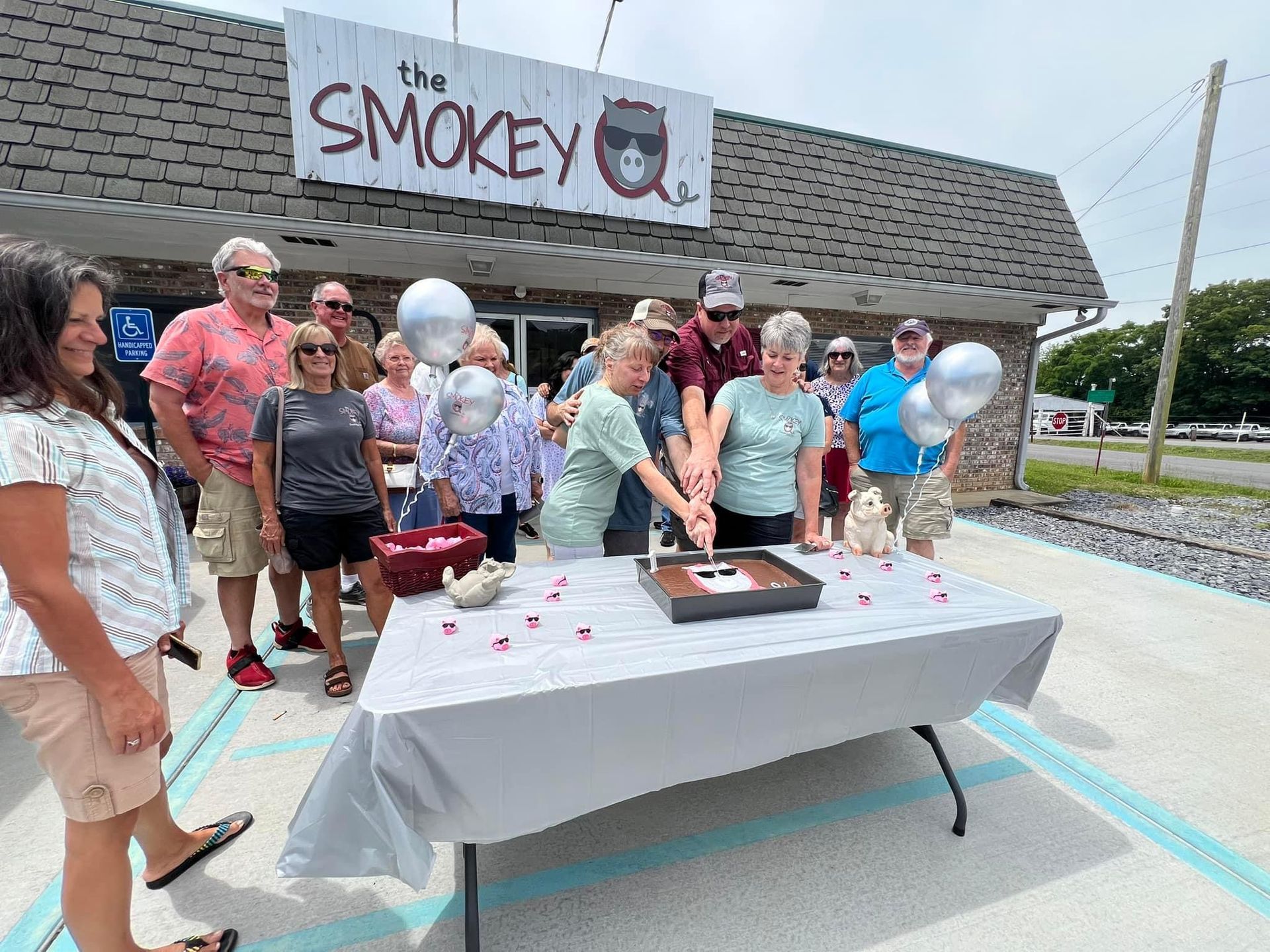 A bunch of ribs are cooking on a grill.