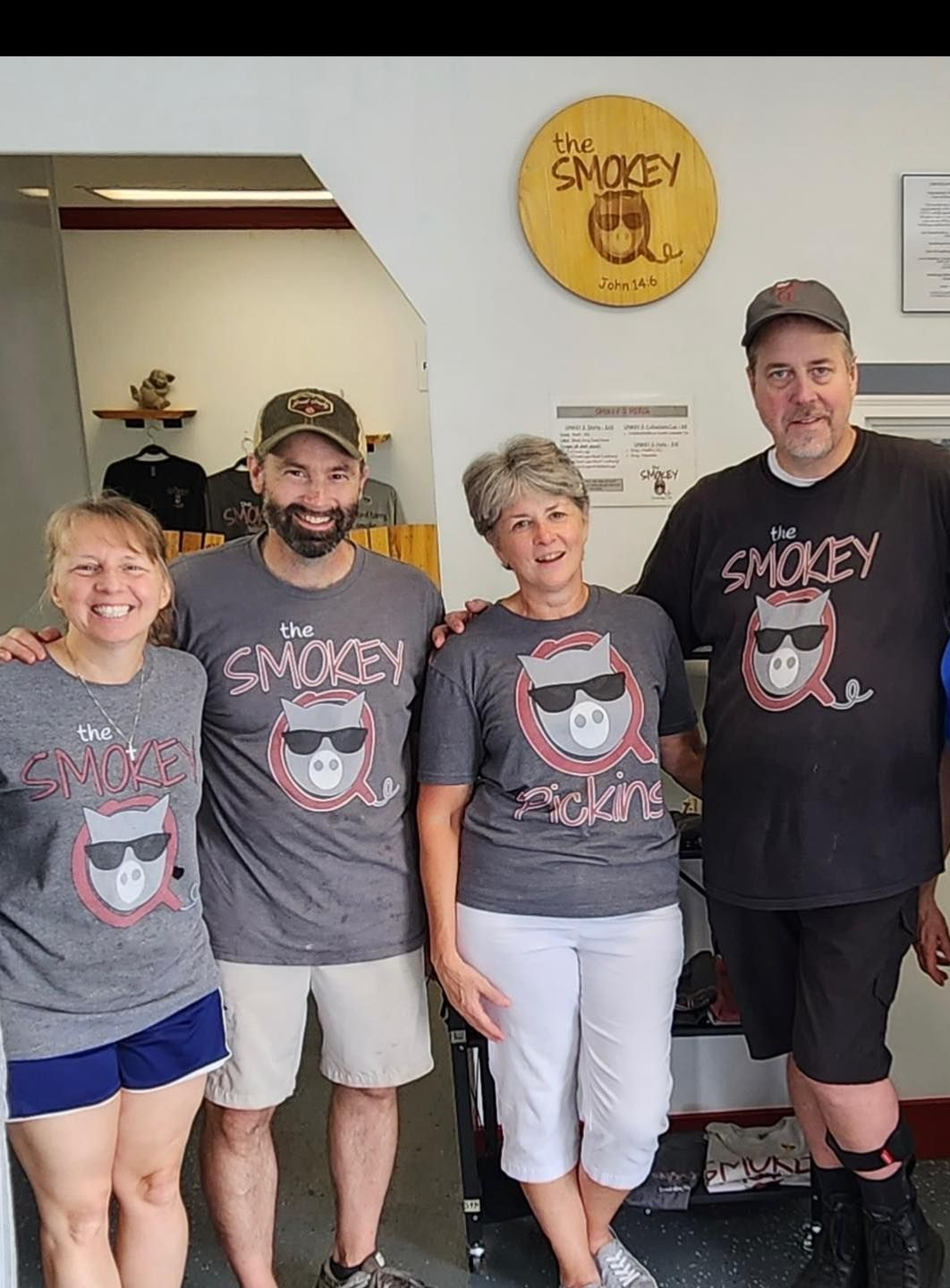 A jar of smokey q sits on a refrigerator shelf