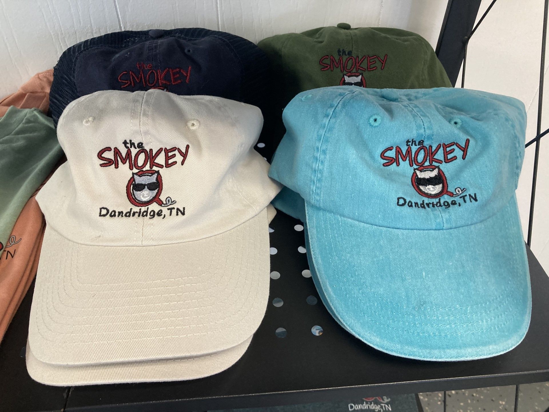 Baseball caps in various colors, with 