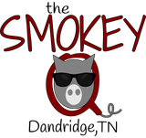 A logo for the smokey dandridge tn with a pig wearing sunglasses.