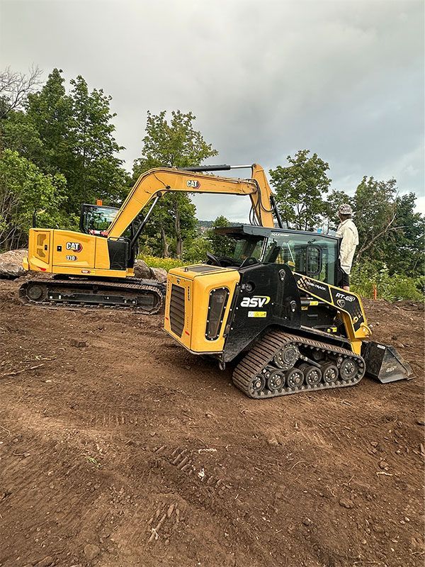 A log cabin with a wooden deck and a toilet in front of it.