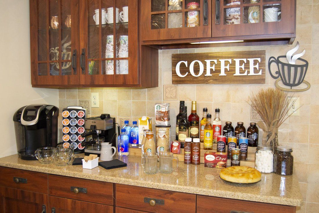 A kitchen with a sign that says coffee on it